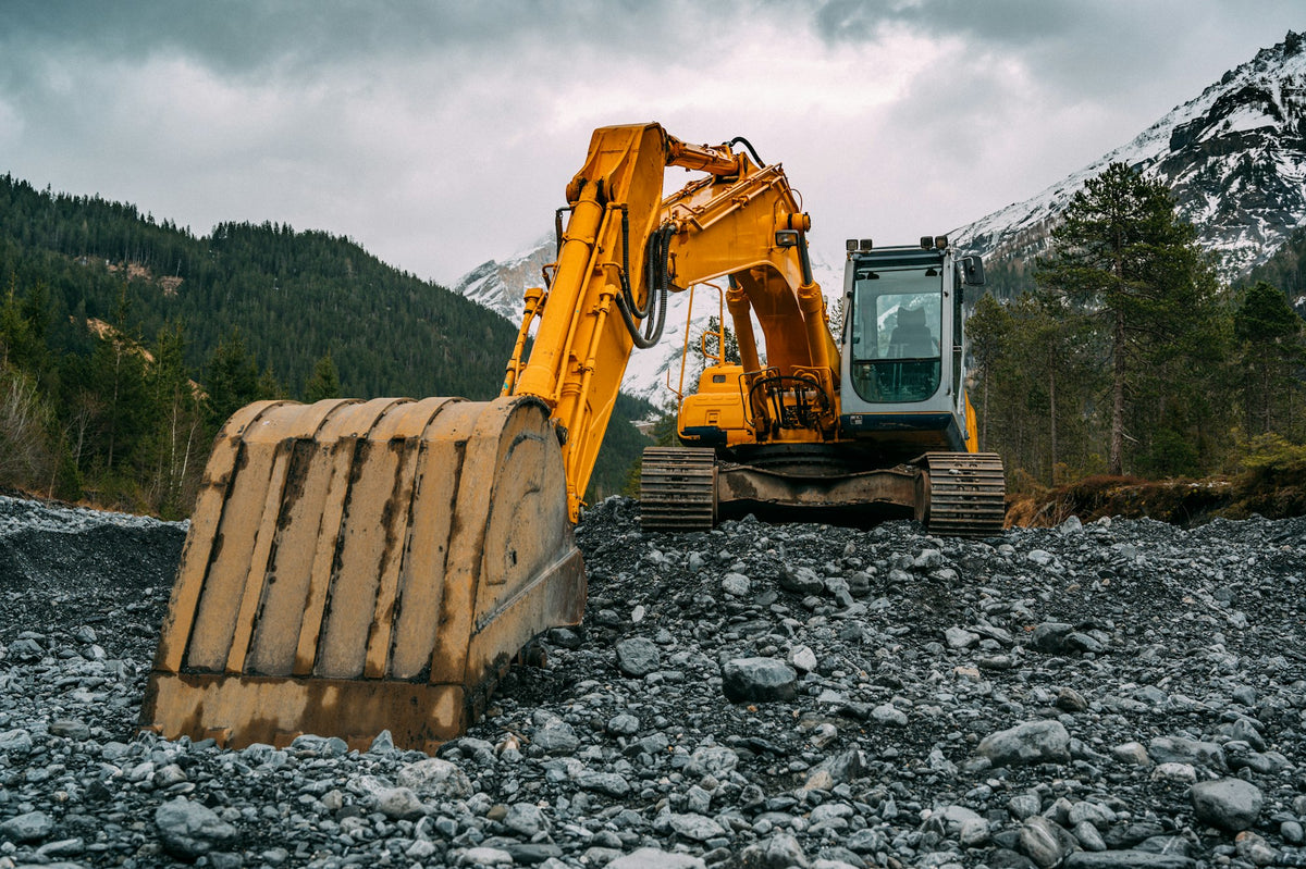 Excavator on a rocky jobsite